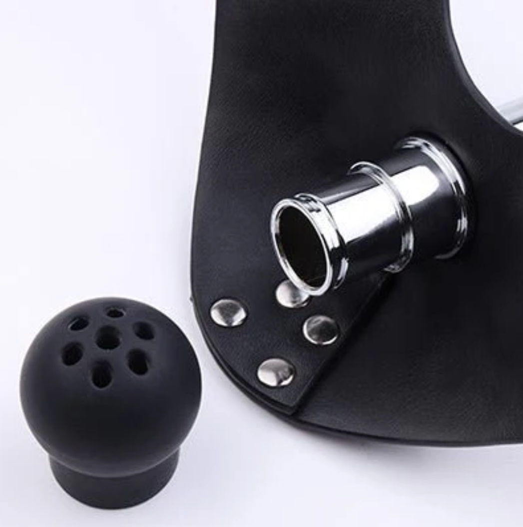 How does a humiliator muzzle-gag control submissive behavior?