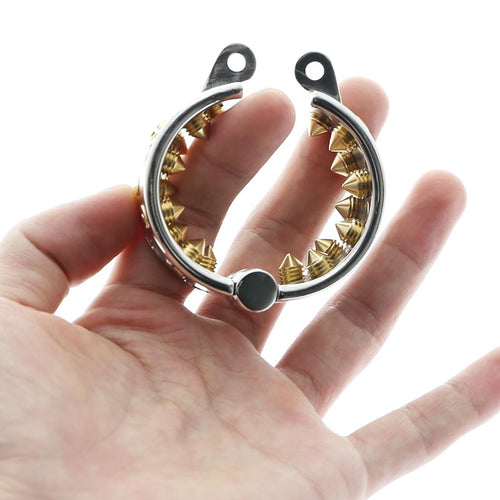 What is a spiked chastity cage with golden teeth?